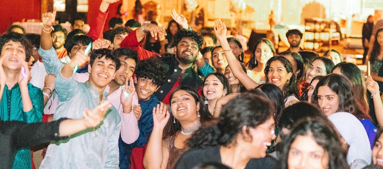 Telugu Youth of America community celebrating together at an event